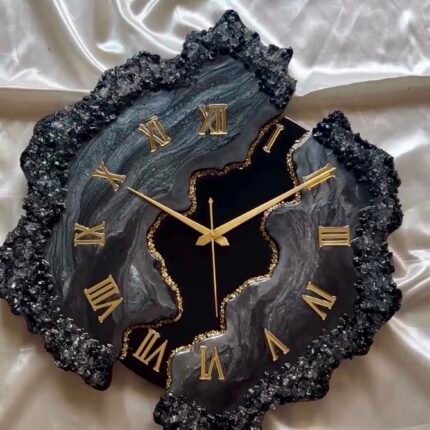 Front view of handmade black resin wall clock with glossy geode finish