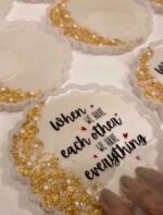 Close-up of handmade personalized resin keepsake with gold leaf, pearls and premium glossy finish.