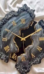 Close-up of gold Roman numerals on handmade resin wall clock