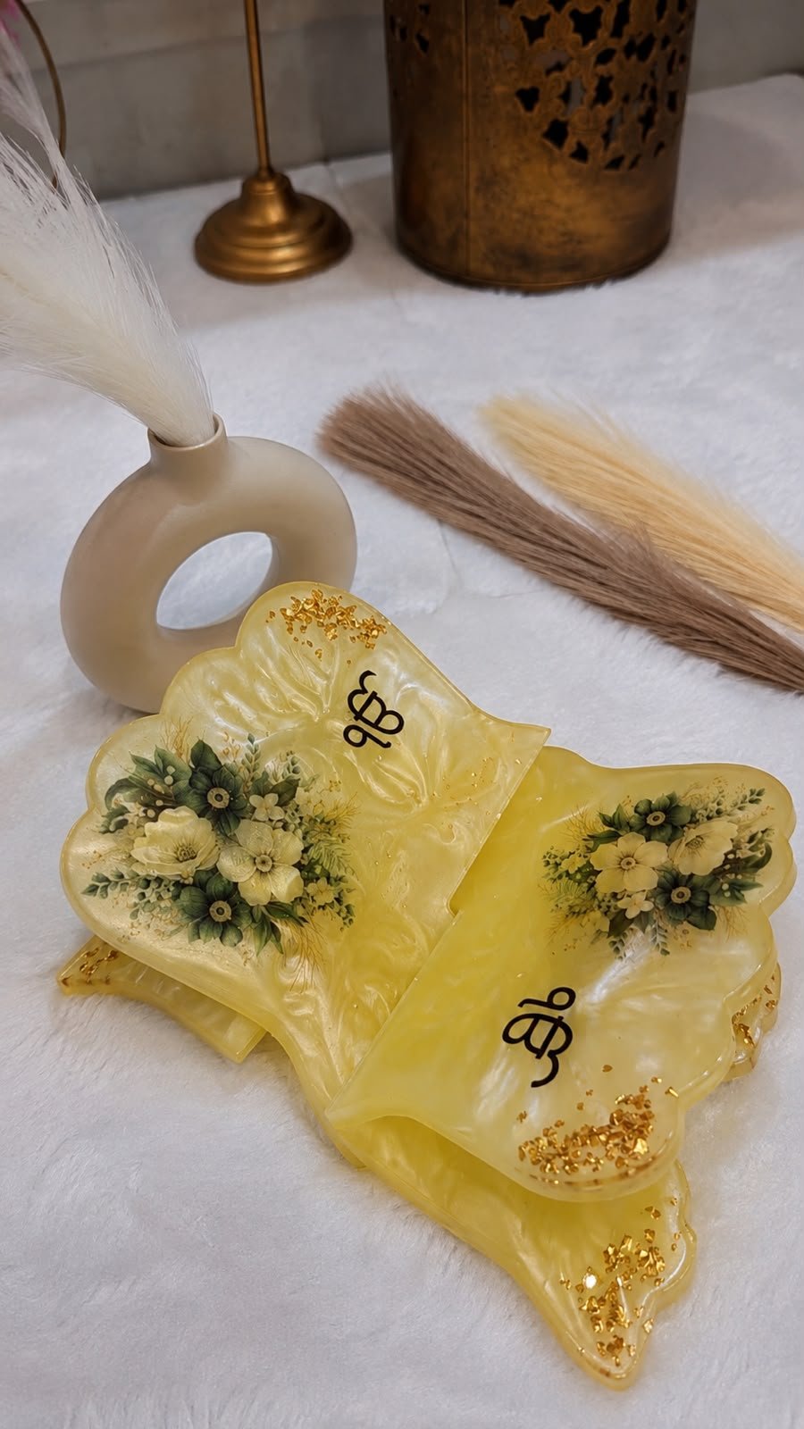 Handcrafted resin Sikh Khanda decor with yellow floral design and gold accents