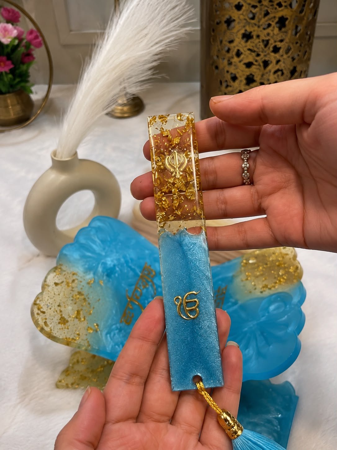 Handmade blue resin Khanda bookmark with gold accents and Sikh religious symbol