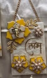 Luxury handmade resin Shubh Labh wall hanging with Lord Ganesha, floral design and decorative pearl tassels.