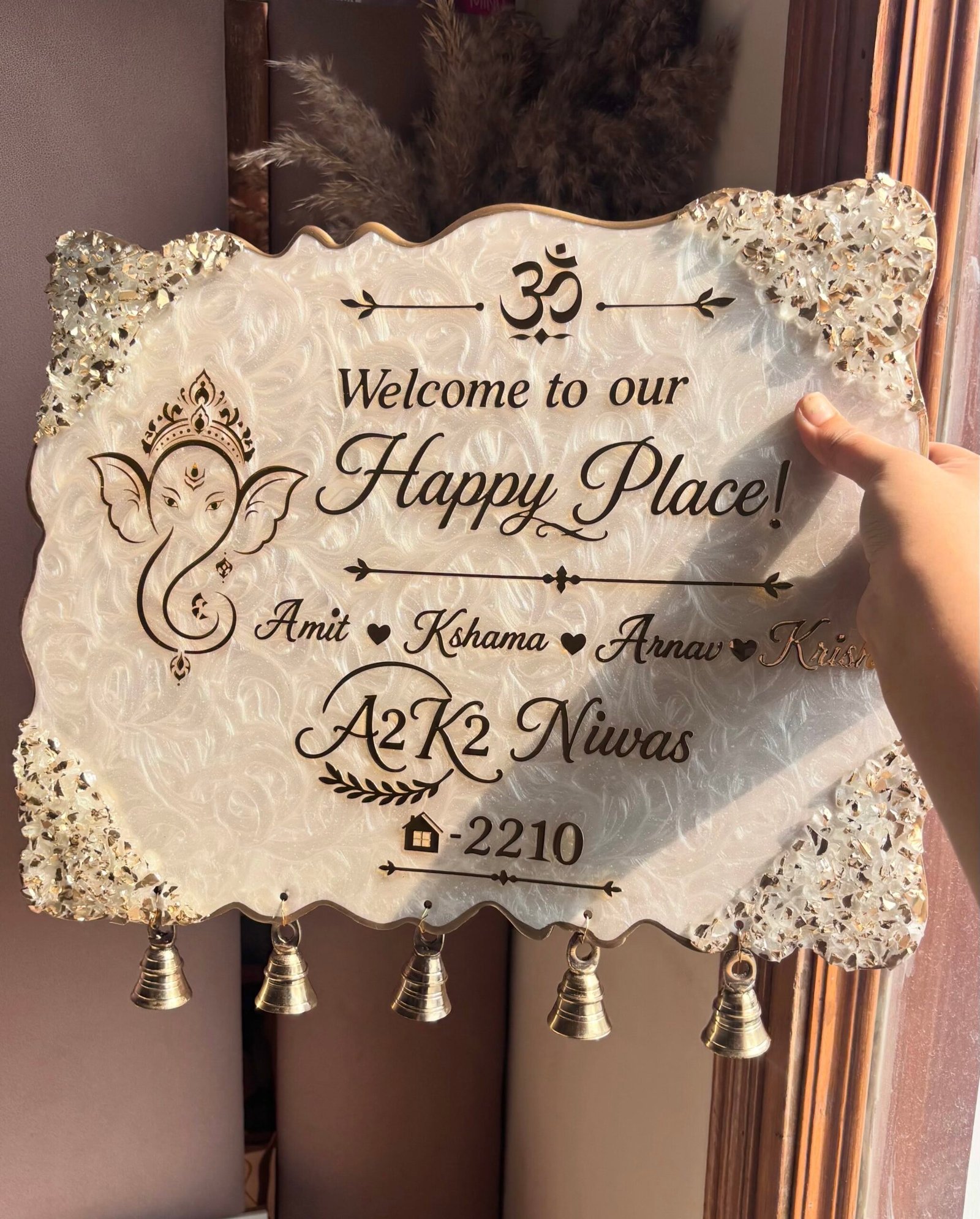 Personalized resin home nameplate with Ganesha design and golden bells