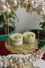 Close-up of ring holders on handcrafted resin wedding platter